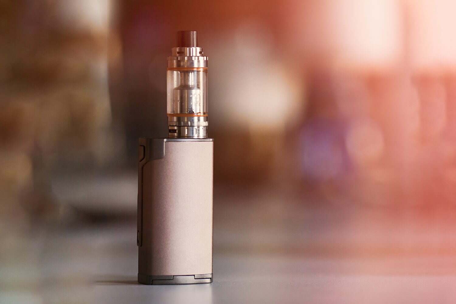 vape, electronic cigarette. blurred background. Popular smoking gadget to people who want to quit smoking nicotine cigarettes and start vaping safe glycerin vape.Trendy electronic cigarette or ecig.